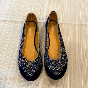 Sprakly and feminine black slip ons.